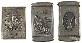 Three nickel plated advertising match vesta safes, to include one with high relief elk, inscribed on