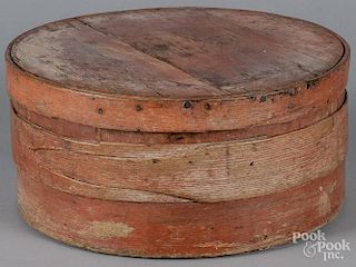 Bentwood box, 19th c., retaining its original red surface, 7'' h., 14 1/2'' w.