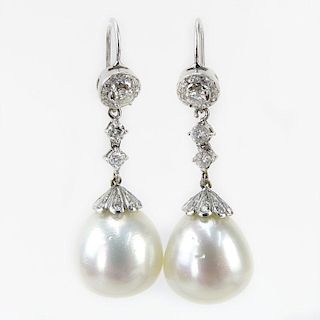 91 Carat Round Brilliant Cut Diamond and 18 Karat White Gold Pendant Earrings. Pearls with good luster, minor natural blemish