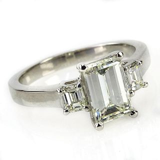 1.92 Carat TW Diamond and Platinum Engagement Ring. Set in the center with an approx. 1.55 carat emerald cut diamond and acce