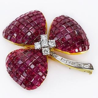 32.50 Carat Invisible Set Square Cut Ruby, .58 Carat Diamond and 18 Karat Yellow Gold Flower Brooch.