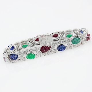 . 4.56 Carat Carved Emerald, 3.57 Carat Carved Sapphire, 5.93 Carat Carved Ruby, 1.10 Carat Round Brilliant Cut Diamond and P