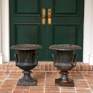 Pair old black painted cast iron garden urns