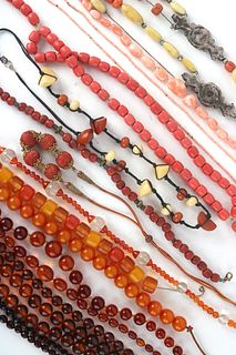 Fifteen Strands of Orange/Amber Colored Necklaces
