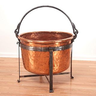 Large copper cauldron on wrought iron stand