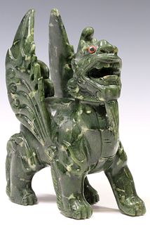 CHINESE DARK GREEN HARDSTONE CARVING OF A WINGED LION