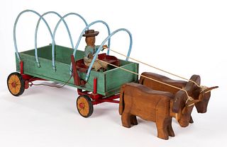 AMERICAN FOLK ART CARVED AND PAINTED COVERED OX WAGON