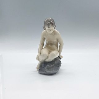 Royal Copenhagen Porcelain Figurine, Girl on Stone 4027