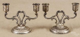 Pair of Cartier weighted sterling silver candelabra, 4 1/8'' h.