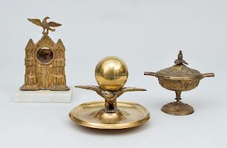 Brass Eagle-Form Inkwell, a Gilt-Bronze Watch Holder, a Brass Covered Tazza, and a Miniature Fireplace and Fire Tool Set