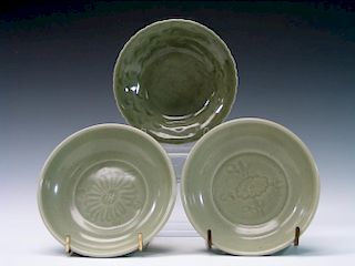 Three Chinese celadon porcelain dishes.