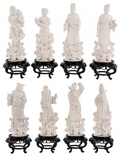 Eight Blanc de Chine Standing Figures on Stands