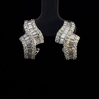 14K White Gold  and Diamond Bypass Earrings.