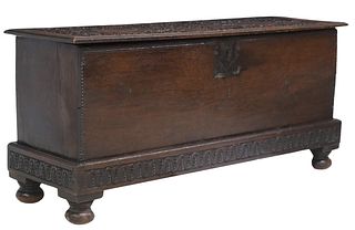 ENGLISH CARVED OAK SIX-BOARD CHEST ON INTEGRAL STAND