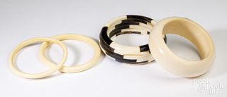 Four ivory and horn bangle bracelets