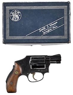 Smith & Wesson model 40, five-shot revolver, .38 special caliber, blued with walnut grips and a 2''
