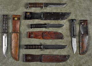 Five WW II era knives, to include a U.S.N. Mark I Colonial deck knife with sheath and hard rubbe