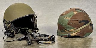 Combat vehicle crewman helmet with microphone, together with a camouflage wrapped helmet.