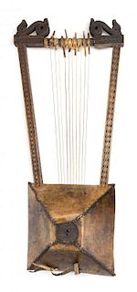 A Carved Wood and Rawhide Harp, ETHIOPIA,