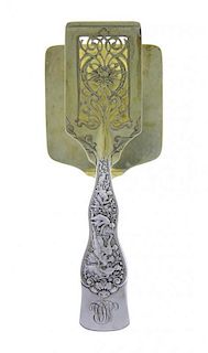 * An American Parcel-Gilt Silver Asparagus Server, Tiffany & Co., New York, NY, Circa 1880, Olympian pattern, the handle engrave