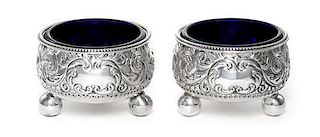 A Pair of Victorian Silver Salts, William Evans, London, 1882, in Georgian style, the circular bodies chased with scrolling acan
