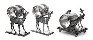 Three American Silver-Plate Figural Napkin Rings with Deer, Late 19th Century, comprising a pair on rectangular bases with deer