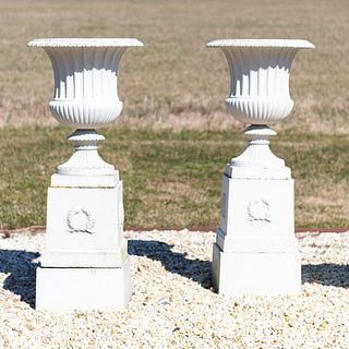 Pair of Large White Painted Cast-Iron Garden Urns on Pedestals