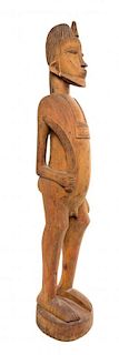 A Senufo Style Carved Wood Male Figure with Sword, WEST AFRICA,