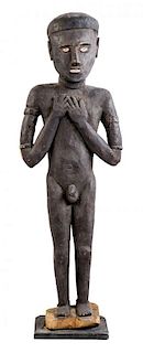 A Carved Wood Figure of a Male, SOLOMON ISLANDS, FIRST HALF OF 20TH CENTURY,