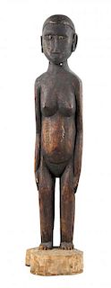 A Carved Wood Female Figure, SOLOMON ISLANDS, FIRST HALF OF 20TH CENTURY,