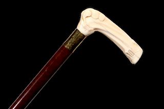 A 19TH CENTURY CANE WITH CARVED IVORY HANDLE