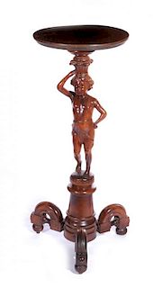 A CIRCA 1900 CARVED PUTTO FIGURAL PLANT STAND