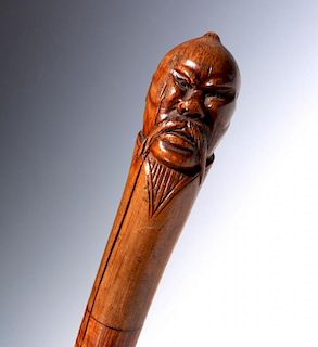 A 19TH C. CARVED MANCHURIAN MALE HEAD WALKING STICK