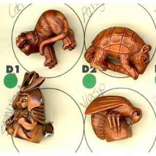 A small card of assorted wood buttons including animals.