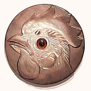 A division three hand carved studio button