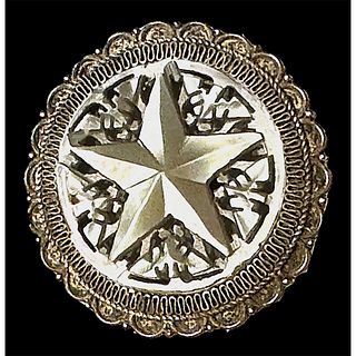 A division three carved star pearl button