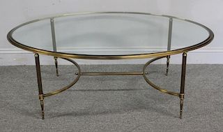 Oval Brass Cocktail Table with Glass Top.