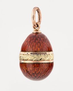 [FABERGE] A MINIATURE GOLD AND GUILLOCHE ENAMEL EGG PENDANT, MARK OF FABERGE WORKMASTER AUGUST HOLLMING, ST. PETERSBURG, 1899