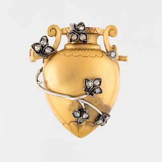 A FRENCH ANTIQUE GOLD BROOCH IN THE FORM OF AN AMPHORA WITH DIAMOND ACCENTS