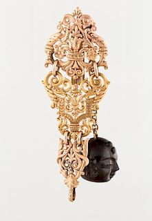 A TWO-TONED GOLD WATCH FOB WITH A CARVED BUDDHA PENDANT, MARKED TIFFANY & CO