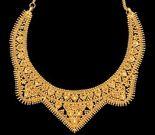 A GRANULATED HIGH KARAT GOLD INDIAN BRIDAL NECKLACE