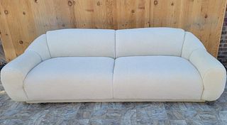 Vintage Postmodern Jean Royere Style Sofa Newly Reupholstered in Natural Shearling