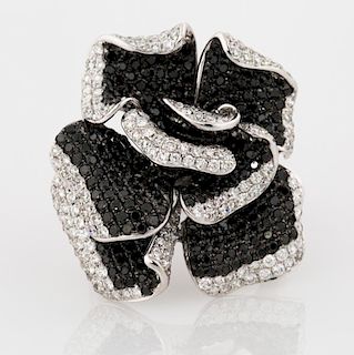 A CHANEL-STYLE ROSE RING IN WHITE AND BLACK DIAMONDS