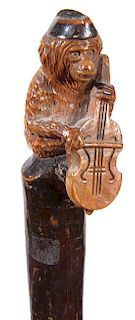 315. Monkey and Violin Folk-Art Cane – Ca. 1880 – A one-piece carved folk-art cane with a monkey atop playing a violin, t