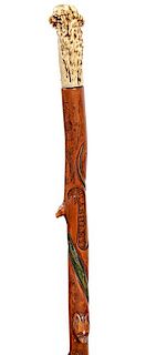324. George Washington Folk-Art Cane – Ca. 1830 – A natural stag handle, inked and etched throughout the cane are carving