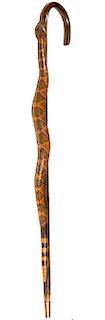 327. Folk-Art Snake Cane – Ca. 1978 – A crutch handle hickory cane with a large paint decorated and carved snake, cane is