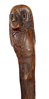 325. Nate Turner Folk-Art Cane – Ca. 1870 – A one-piece twigspur cane with a carving of who appears to be Nate Turner, th