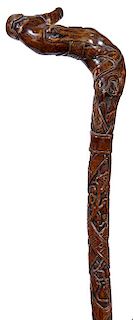 347. German Folk-Art Cane – Dated 1916 – A one-piece folk cane which has acorns and other vegetation carved on the top ha