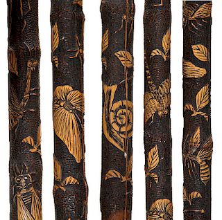 352. Japanese Carved Folk-Art Cane – Ca. 1890 – A split bamboo root cane which has various animals including locusts, dra