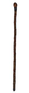 354. Japanese Carved Folk-Art Cane – Ca.1890 – A split bamboo root cane with an ornate silver metal hand-worked collar, a
